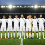 England football team in white shirts during a pre-match lineup at a major tournament