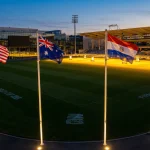 World Cup stadium with international flags USA Australia Paraguay Turkey at night