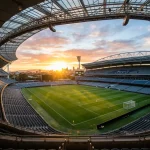 World Cup stadium field with match schedule time 6:30 AM AEST scoreboard