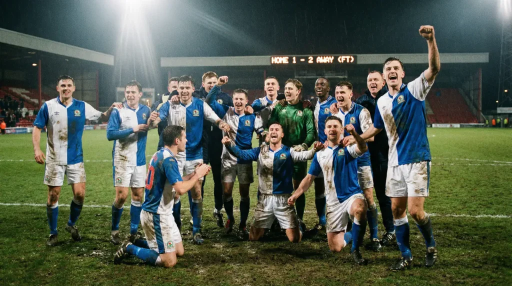 Soccer team celebrating victory on stadium pitch after winning football match