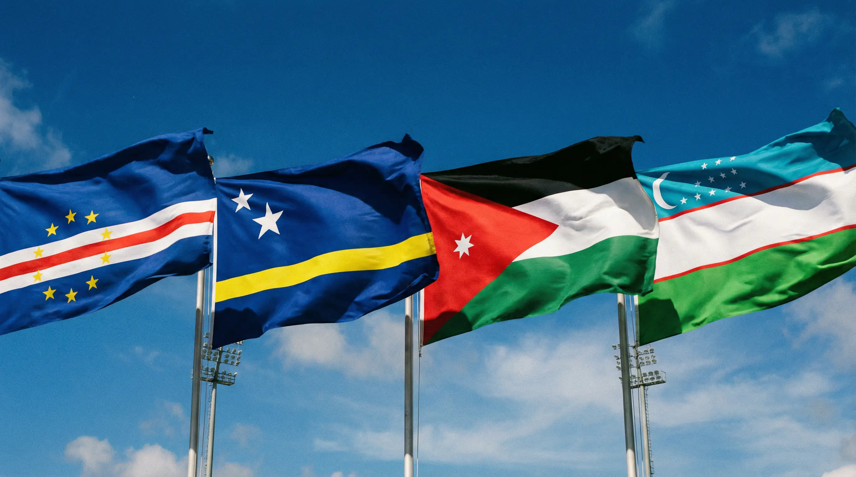 Flags of Cabo Verde, Curaçao, Jordan and Uzbekistan representing the four World Cup 2026 debutant nations